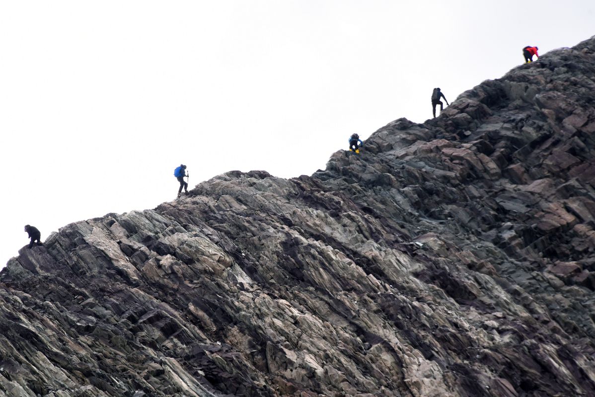 15B Climbers Scrambling Up The Rocky Rhodes Bluff From The Top Of The Valley Next To Elephants Head Near Union Glacier Camp Antarctica